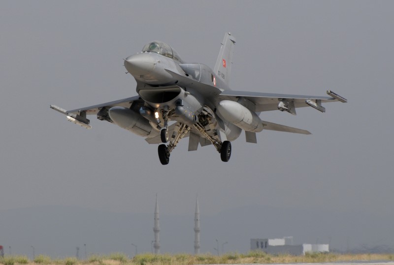 Photo 18.JPG -  A typical image in Anatolian Eagle; a returning Turkish F-16 over the minarets of a mosque in Konya
